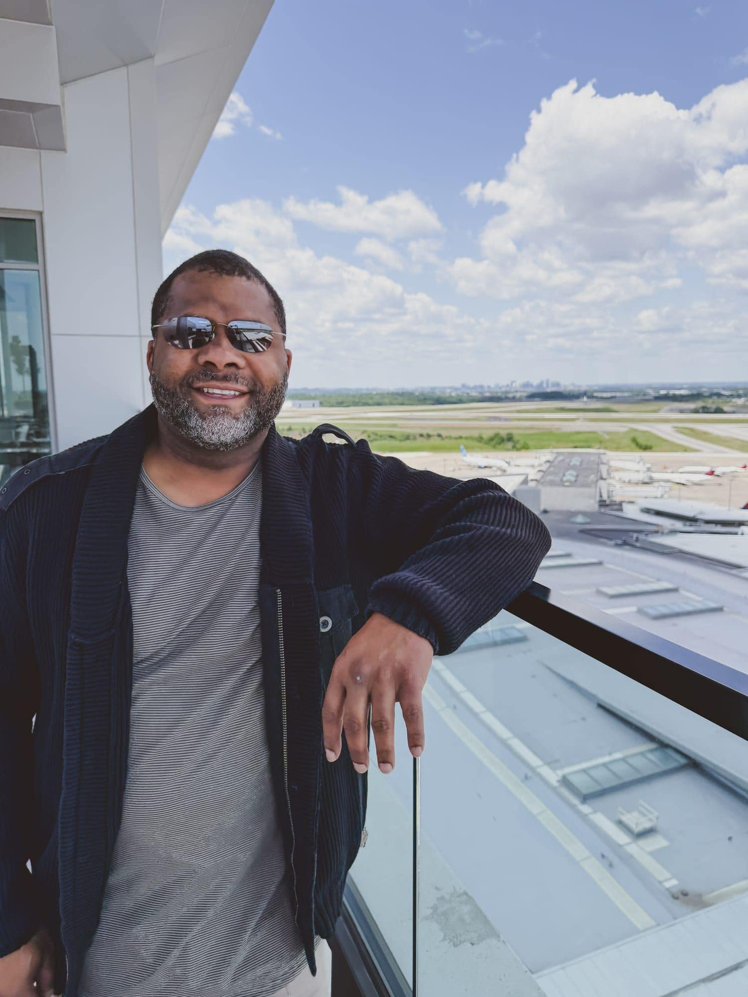 Gavin Brooks on an airport observation deck above the runways