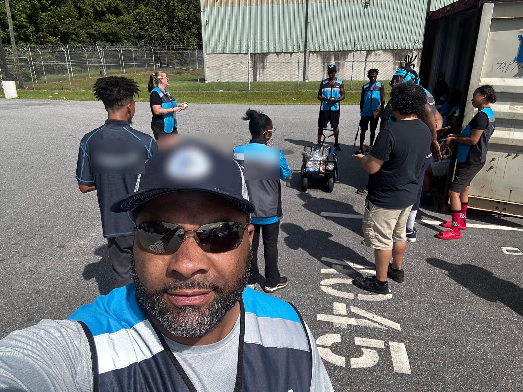 Gavin Brooks with the crew at a last-mile delivery station