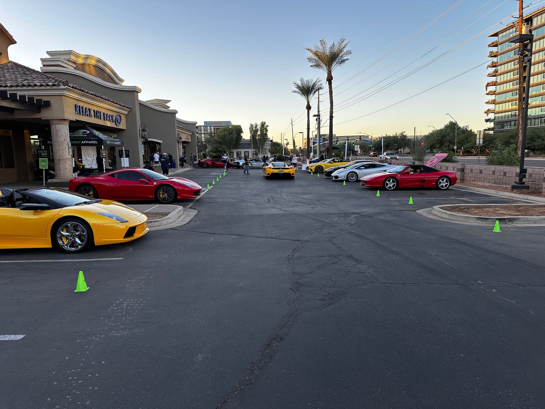 Ferraris and Lamborghinis lined up outside storefronts at Tires & Timepieces, Scottsdale