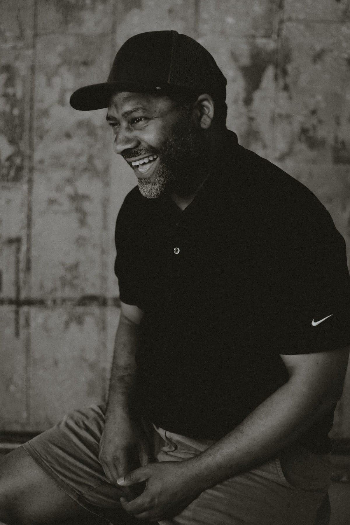 Portrait of Gavin Brooks, laughing, in black and white